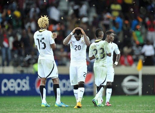 Ghana's players react at the end of the penalty shootout on February 6, 2013